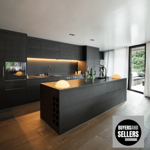 Contemporary kitchen with black cabinetry, island, and natural light in West London.Kitchen Development by Buyers and Sellers