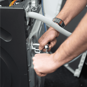 Tullys German Appliance Engineer repairing a Miele Appliance