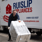 Tristan, an empolyee of Ruislip Appliances, delivering a new washing machine